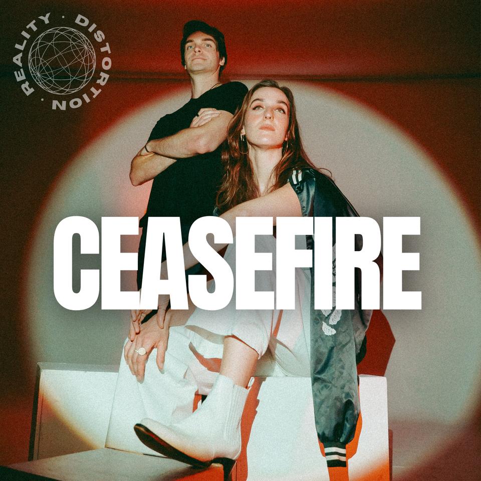 Devon and Linnea Seegers of Reality Distortion in a warm spotlight, on the Ceasefire EP cover